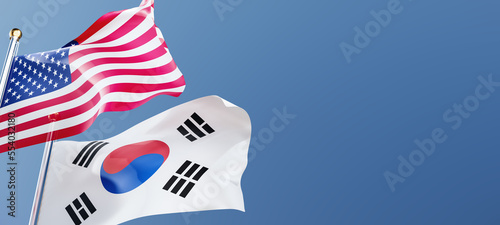 Canvastavla Usa and Korea flags fluttering in the wind against a blue sky mockup with copy space