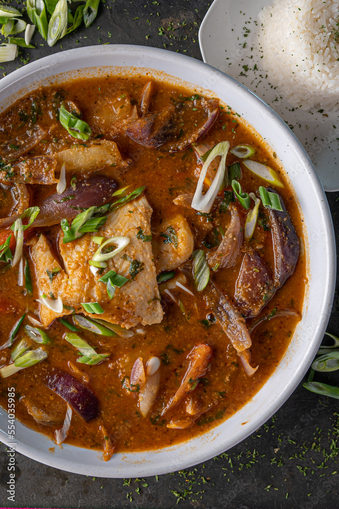 Sudado de Pescado, a traditional steamed fish stew from Peru served with rice. Sudado de Pescado, a traditional steamed fish stew from Peru served with rice.