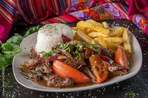 Lomo saltado, a traditional Peruvian stir fry that combines marinated strips of sirloin with onions, tomatoes, french fries and rice.