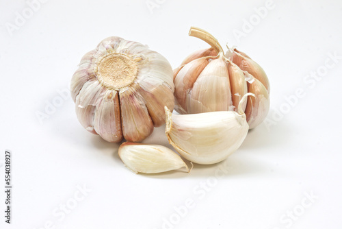 Garlic cloves on white background.