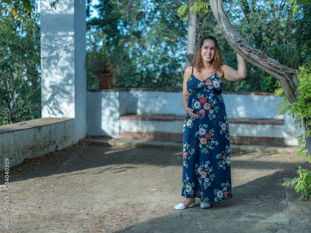 Pregnant Brazilian woman posing in the parks of Montjuic, Barcelona