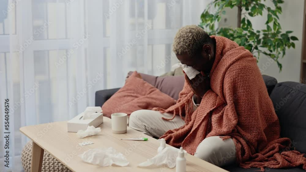 Sick african american man in selfmedication having fever and chills