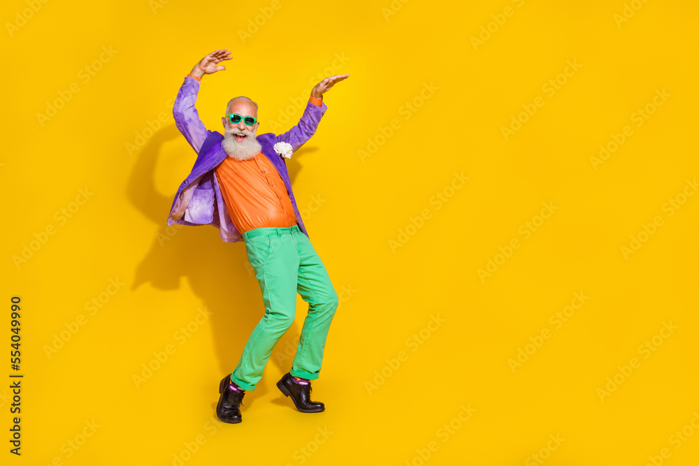 Full length photo of attractive grandpa dancing boogie woogie tiptoes dressed stylish colorful outfit isolated on yellow color background