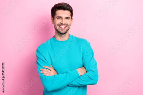 Portrait of young satisfied good mood smiling businessman wear sweatshirt folded hands successful company owner isolated on pink color background © deagreez