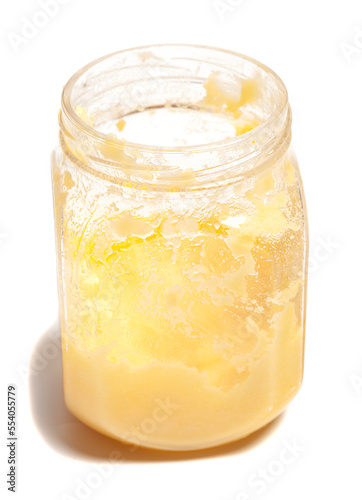 Ghee in jar isolated on white background.
