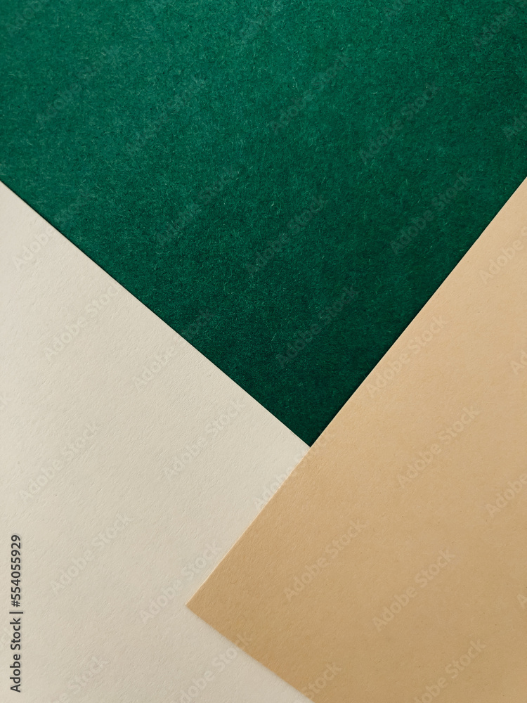 Abstract colourful paper background on office table with texture. Green, beige, white Abstract colourful paper background on office table with texture. Green, beige, white