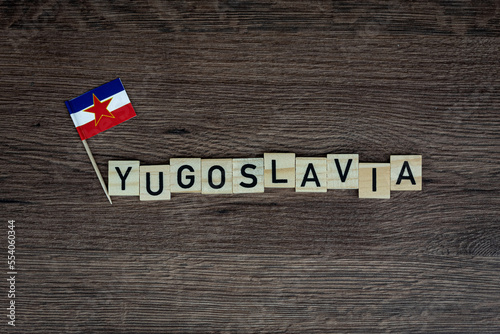 Yugoslavia - wooden word with yugoslavia flag (wooden letters, wooden sign) photo