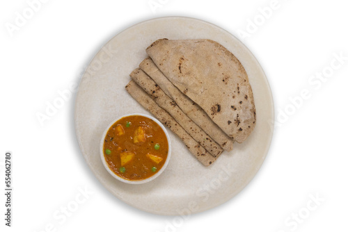 Homemade soft roti whole wheat chappathi known as indian bread or phulkan, kulcha meal combo with paneer butter masala photo
