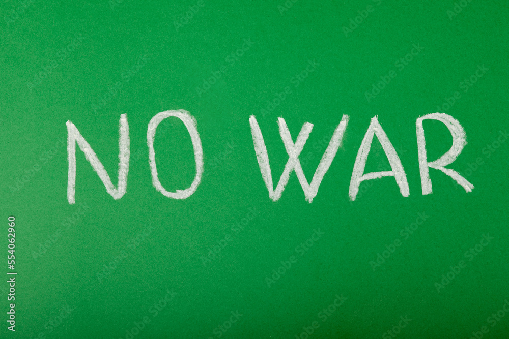 Chalk lettering NO WAR on a green blackboard. Chalk lettering NO WAR on a green blackboard.