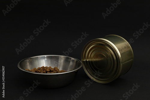 Canned food in a tin on a black background