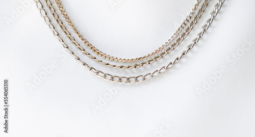 Group of gold and silver chain necklace isolated background