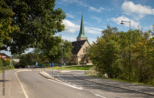 Sweden. Stone church at the crossroads against the blue sky