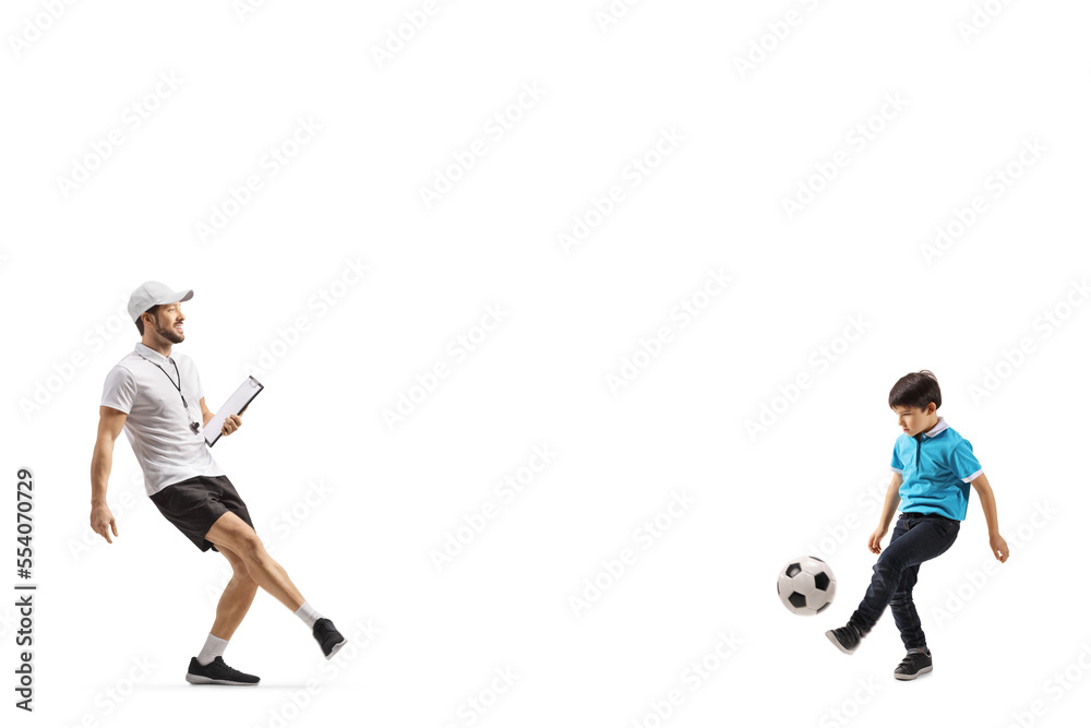 Football coach playing football with a boy Football coach playing football with a boy