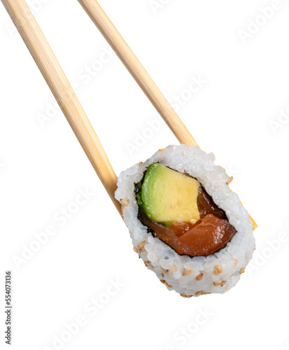 chopsticks holding a piece of sushi