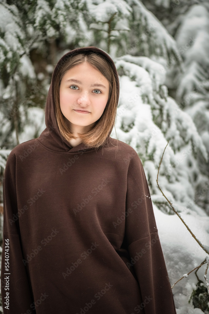 Portrait of a young beautiful girl in the winter forest. Portrait of a young beautiful girl in the winter forest.
