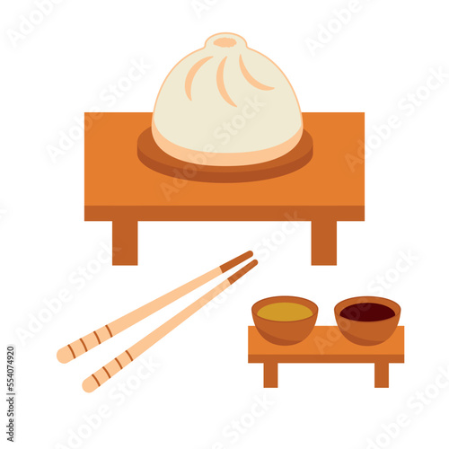Dumpling with chopsticks and bowls with sauce. Traditional asian cuisine and food.
