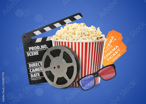 Картината върху платно Movie clapper, tickets, pop corn, 3D glasses and film reel on blue background
