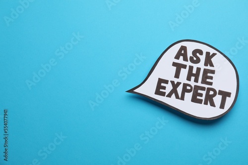 Speech bubble sticker with phrase Ask The Expert on light blue background. Space for text photo