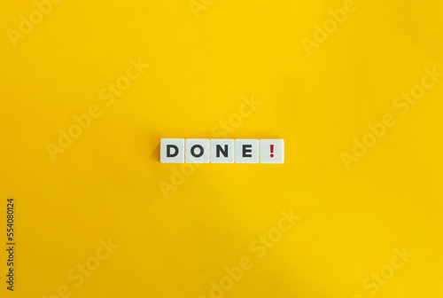 Done Word on Letter Tiles on Yellow Background. Minimal Aesthetics.