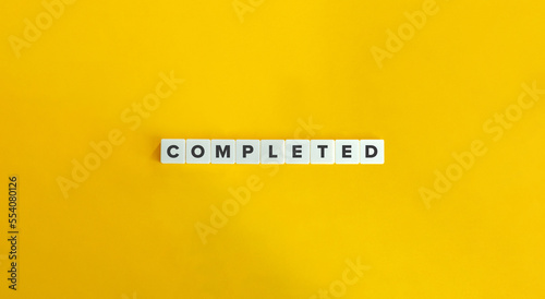 Completed Word on Letter Tiles on Yellow Background. Minimal Aesthetics.