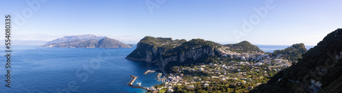 Fototapeta Naklejka Na Ścianę i Meble -  Touristic Town on Capri Island in Bay of Naples, Italy. Sunny Blue Sky. Panorama