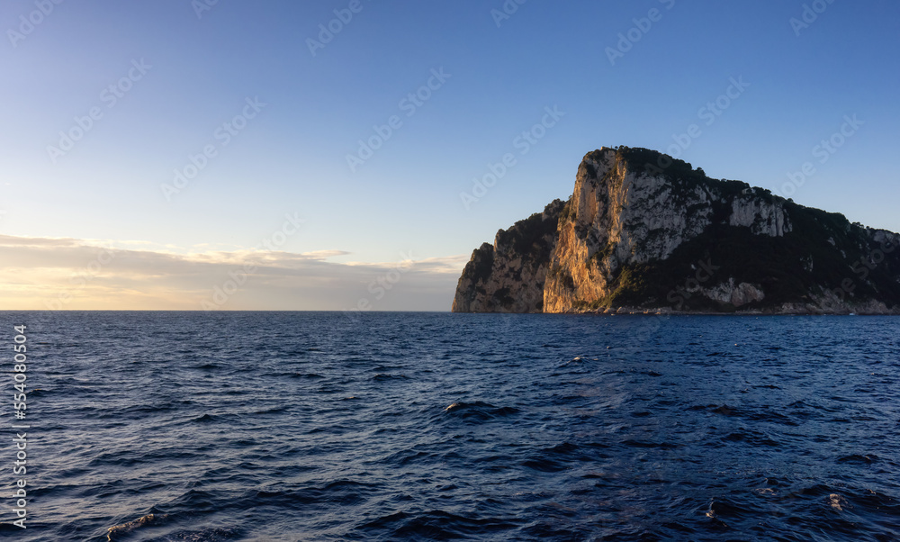 Capri Island in Bay of Naples, Italy. Sunny Sunrise Sky. Nature Background. Capri Island in Bay of Naples, Italy. Sunny Sunrise Sky. Nature Background.