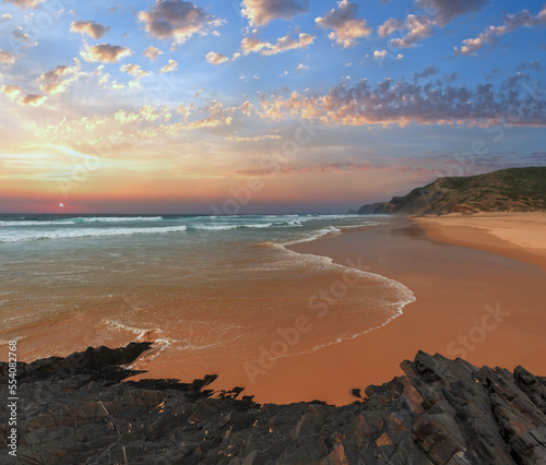 Storm on Castelejo beach with black schist cliffs (Algarve, Portugal).