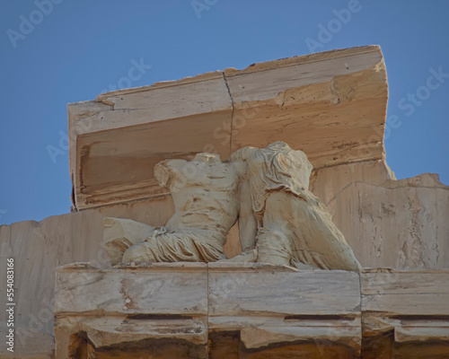 A partial view of Parthenon's ancient temple and clear blue sky as a background. Acropolis of Athens, Greece. photo