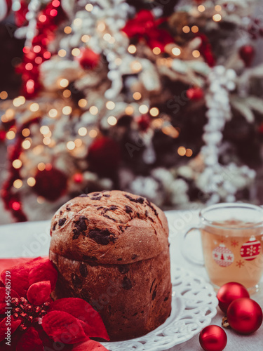 panetonne with tea and Christmas decoration on concrete background.