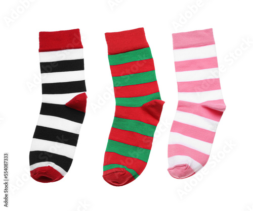 Different striped socks on white background, top view