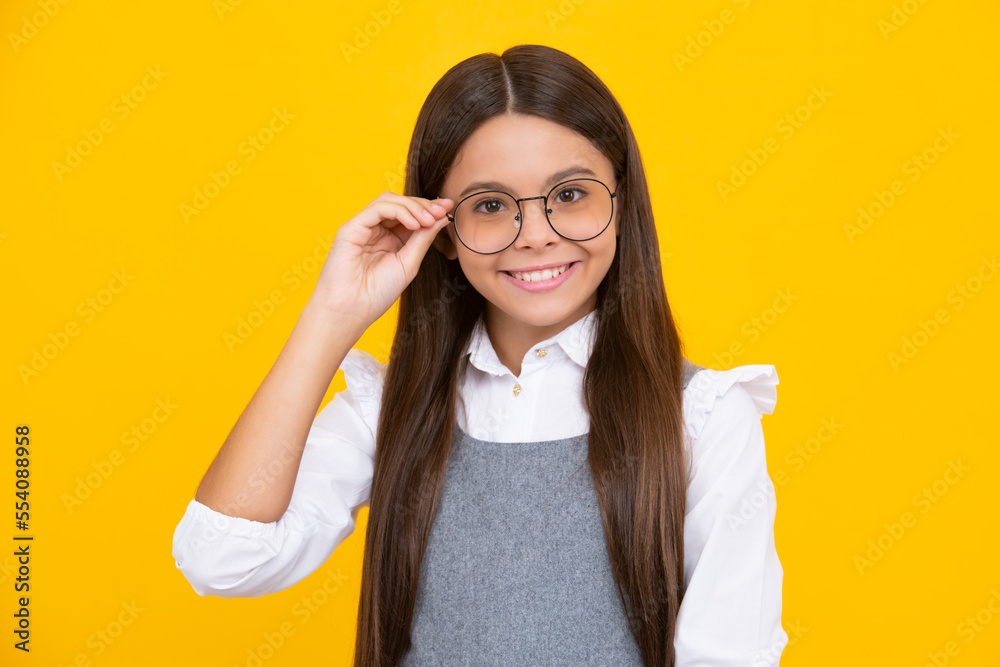 Portrait of teenager child girl in glasses. Kid at eye sight test. Girl with eyeglasses and looking at camera. Vision for children. Happy girl face, positive and smiling emotions.