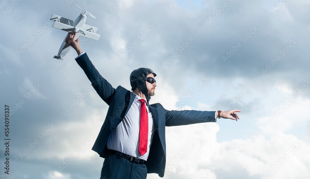 business person in suit and pilot hat launch plane toy on sky background business person in suit and pilot hat launch plane toy on sky background