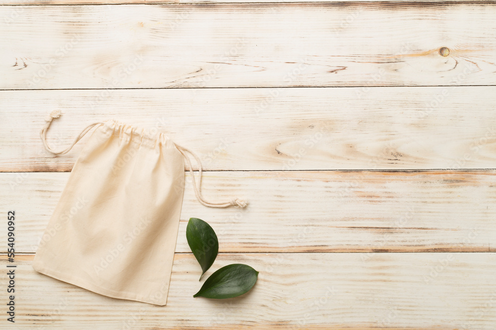 Small eco sack on color background. Top view. Small eco sack on color background. Top view.
