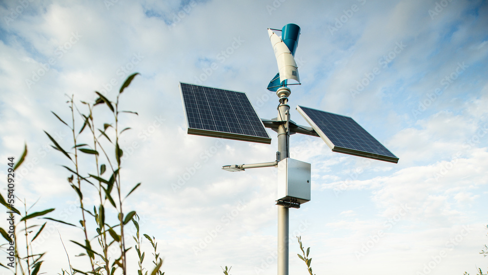 Pair of solar panels on a pole. Ecological energy. Cloudy sky. Pair of solar panels on a pole. Ecological energy. Cloudy sky.