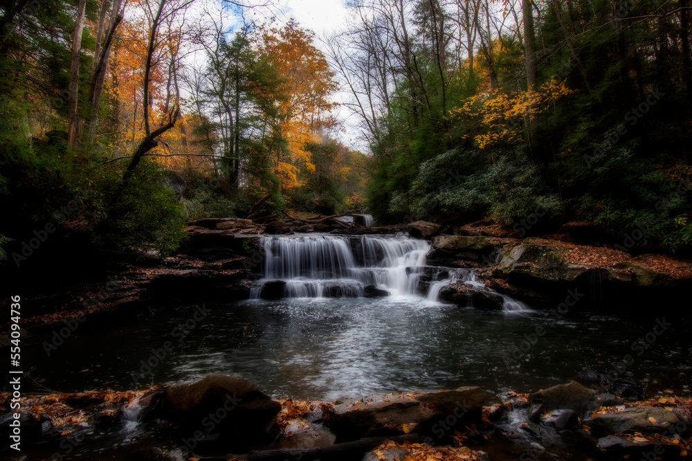 Waterfall in the fall small stream in the woods