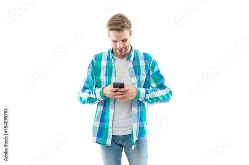busy man texting on phone wearing checkered shirt. photo of man texting on phone device