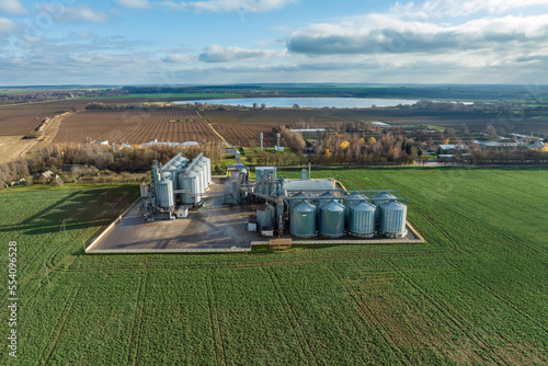 aerial view of huge agro-industrial complex with silos and grain drying line