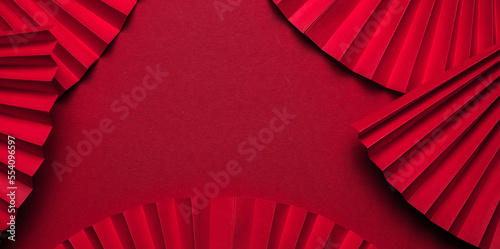 Chinese New Year 2023 .Decor pattern fan on red background. Red paper fans .Lunar New Year banner template. Color of the year 2023 viva magenta.color pantone Lunar New Year,chinese banner photo