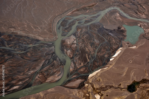 In the far northeastern reaches of Greenland, the landscape is dry except for the milky rivers that drain the small local ice caps.; Greenland.