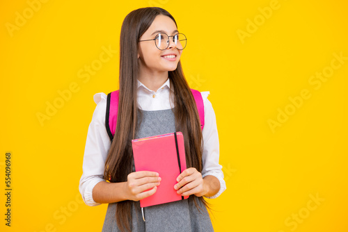 Teenager school girl with books isolated studio background.