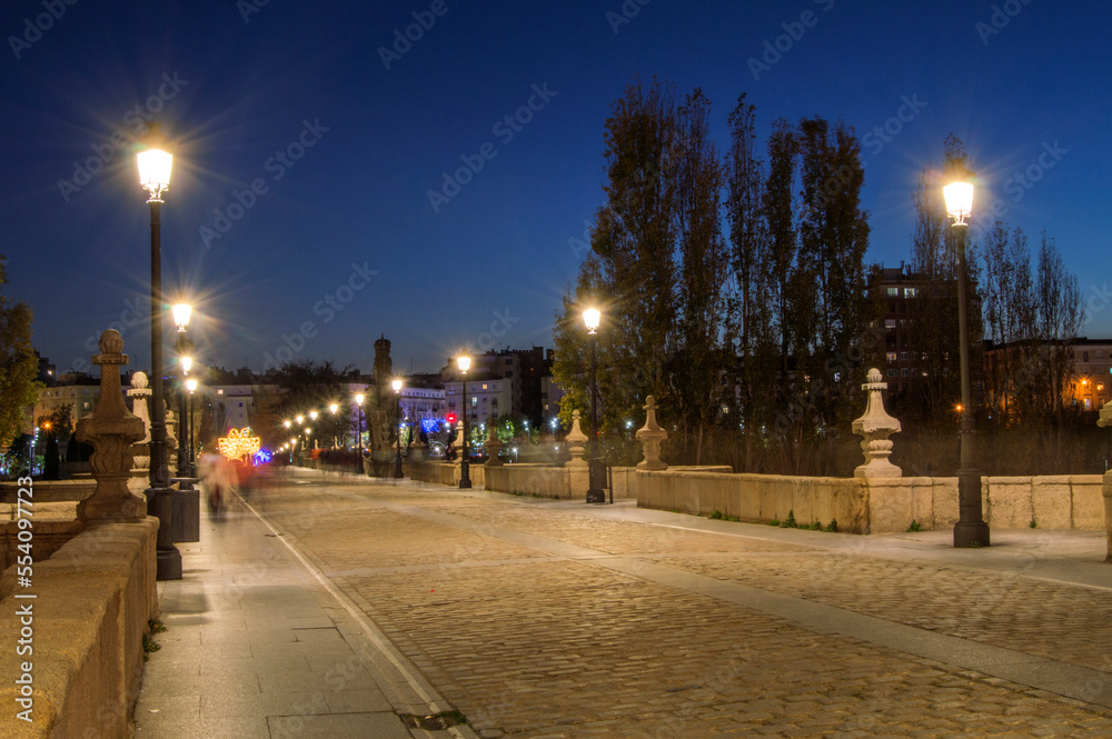 Toledo bridge deck at night with the streetlights on in Madrid. Spain