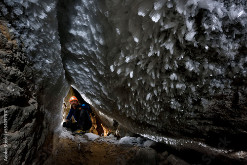 Inside The Crystal Palace at a pont where a small sandy ramp dropped down a meter or so, huge ice crystals covered the ceiling and walls. With caution, it was just possible to pass by without destroyi photo