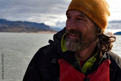 Portrait of chief boatman and reliable expedition member. Photograph taken whilst he was in total control of the Zodiac 3 inflatable boat on lake Centrum. photo