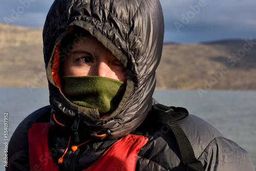 Portrait of expedition leader and driving force behind this whole project, feeling the cold as always aboard the Zodiac 3 inflatable boat on lake Centrum.