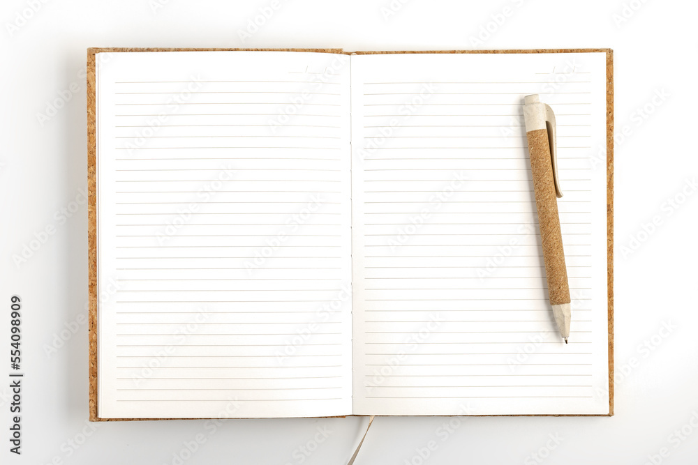 Opened notebook with pen on white background Opened notebook with pen on white background