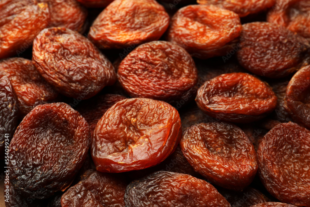 Tasty dried apricots as background, closeup. Healthy snack