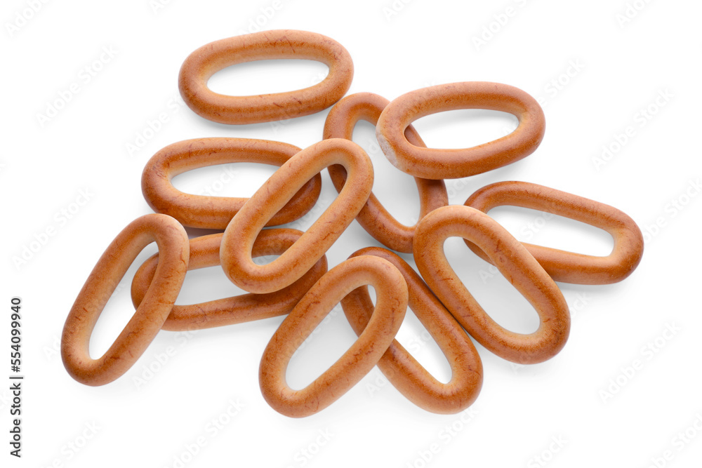 Many tasty dry bagels (sushki) isolated on white, top view Many tasty dry bagels (sushki) isolated on white, top view