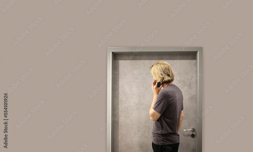 young man opening the door of his house.Inviting the guests young man opening the door of his house.Inviting the guests