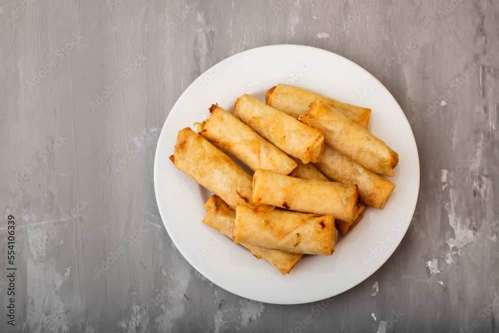 Spring Roll also known as Egg Roll on white dish Spring Roll also known as Egg Roll on white dish