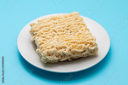 dry fresh noodle cubes on white dish